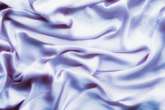 Elegant fabric texture, abstract backdrop and modern pastel colours concept - Purple soft silk waves, flatlay background