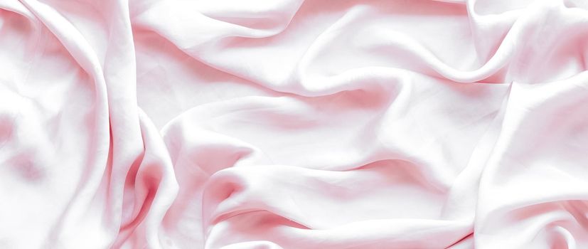 Elegant fabric texture, abstract backdrop and modern pastel colours concept - Pink soft silk waves, flatlay background