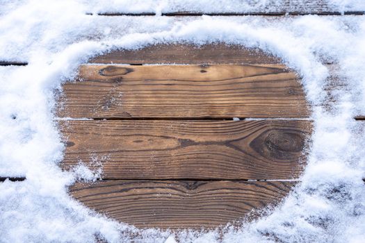 Winter background. Empty wooden plank with snowy border, copy space for text Wood table to. For product display Christmas time mock up