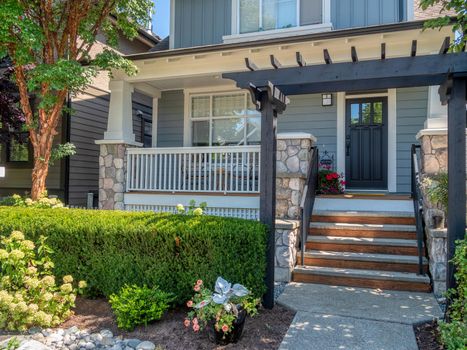 A perfect neighbourhood. Porch and entrance of a nice residential house