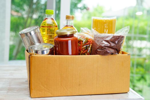 Foodstuffs in donation box for volunteer.