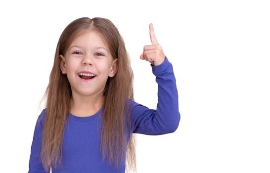 Maked important discovery smiling child kid with raising forefinger up, isolated on white background looking at camera waist up caucasian little girl of 5 years in blue