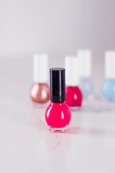 Beauty, make-up and cosmetics concept - Nail polish bottles, manicure and pedicure collection