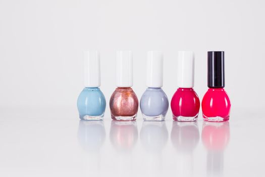 Beauty, make-up and cosmetics concept - Nail polish bottles, manicure and pedicure collection