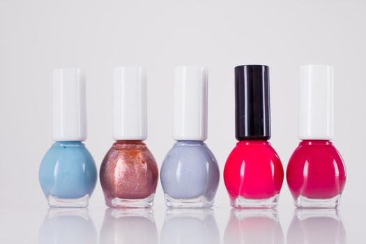 Beauty, make-up and cosmetics concept - Nail polish bottles, manicure and pedicure collection