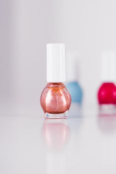 Beauty, make-up and cosmetics concept - Nail polish bottles, manicure and pedicure collection