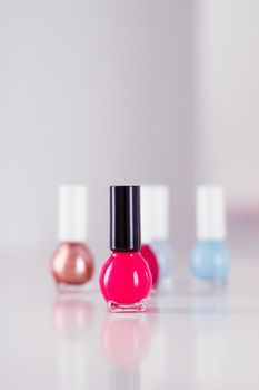 Beauty, make-up and cosmetics concept - Nail polish bottles, manicure and pedicure collection