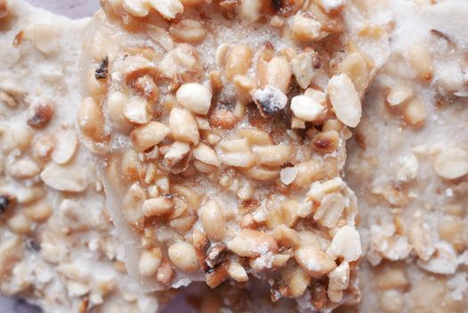 pea nuts sweet bar on a plate close up ,