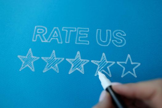 Person marker writes rate feedback to us. Customer service and social media