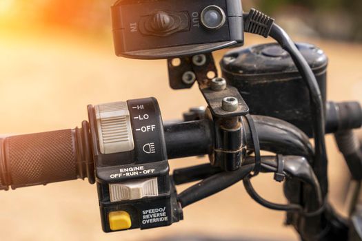 atv controls close-up. switches on the handlebar of the ATV. rubber grips