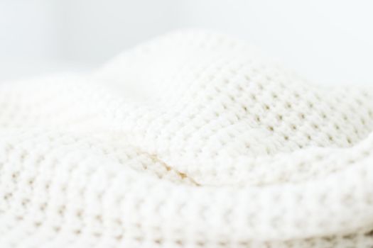 Knitwear, fabric textures and handmade items concept - Warm knitted clothes, soft and white