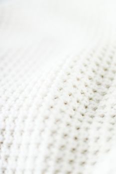 Knitwear, fabric textures and handmade items concept - Warm knitted clothes, soft and white