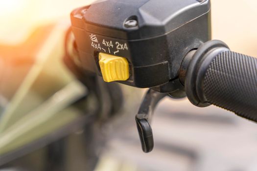 atv controls close-up. switches on the handlebar of the ATV. rubber grips