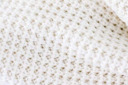 Knitwear, fabric textures and handmade items concept - Warm knitted clothes, soft and white