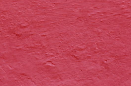 Damaged grunge background . Old red plaster wall texture .