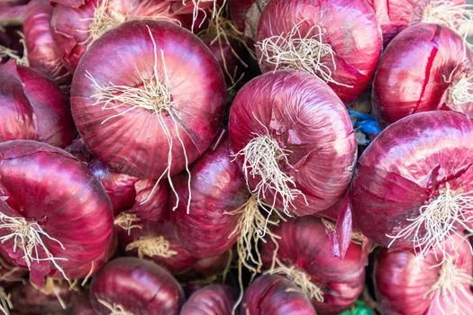 fruits of red onion in close-up as a background. photo