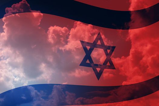 The national flag of Israel against a blue and red sky.