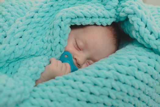 The baby is sleeping in the crib. Sweet baby 's dream . An article about children.
