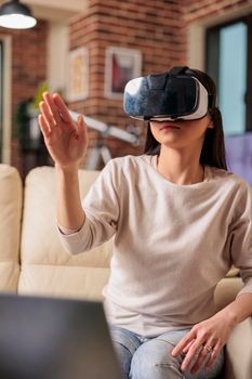 Happy asian woman enjoying wearing VR virtual reality headset, modern glasses technology headset future device gadget digital entertainment game simulation