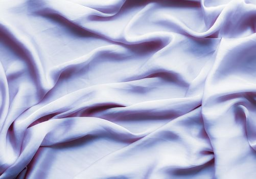 Elegant fabric texture, abstract backdrop and modern pastel colours concept - Purple soft silk waves, flatlay background