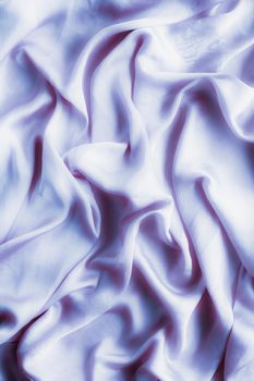 Elegant fabric texture, abstract backdrop and modern pastel colours concept - Purple soft silk waves, flatlay background