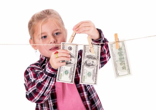 Girl hangs on the money on the rope