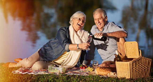 Keeping the romance alive. a happy senior couple enjoying a picnic outdoors
