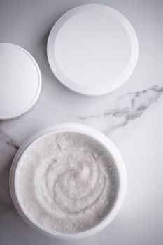 Skincare and body care, luxury spa and clean cosmetic concept. Health and beauty of your skin - Scrub and exfoliating cream products on a marble, flatlay