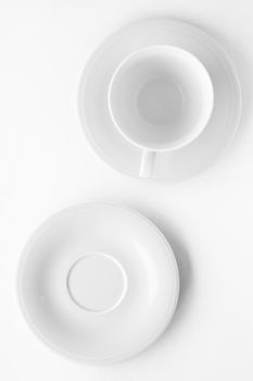 Kitchen, dishware design and drink concept - Empty cup and saucer mockup on white background, flatlay