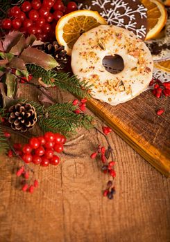 Christmas - baking cake background. Dough ingredients and decorations on vintage planked wood table from above. Rural kitchen layout with free text space.