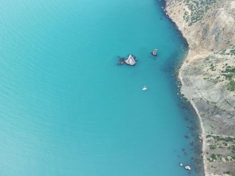 Aerial panoramic view of beautiful sunset above sea. Beautiful seascape. Sun glare, small waves on the water surface. Evening. Horizon. Nobody. No people. Copy space. Never-ending beauty of nature