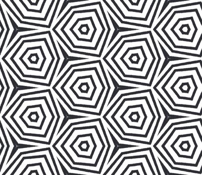 Exotic seamless pattern. Black symmetrical kaleidoscope background. Textile ready outstanding print, swimwear fabric, wallpaper, wrapping. Summer swimwear exotic seamless design.