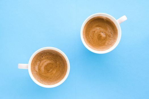 Breakfast, drinks and modern lifestyle concept - Hot aromatic coffee on blue background, flatlay