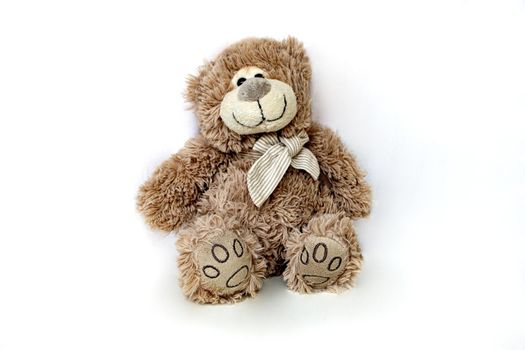 Lovely brown bear doll isolated on white background. Adorable teddy bear for decorative. High quality photo