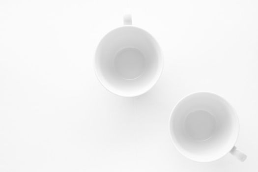 Kitchen, dishware design and drink concept - Empty cup and saucer mockup on white background, flatlay