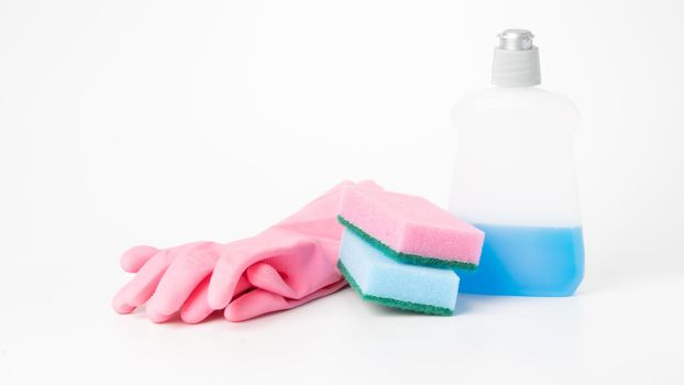 Detergent, sponges and rubber gloves on a white background. High quality photo