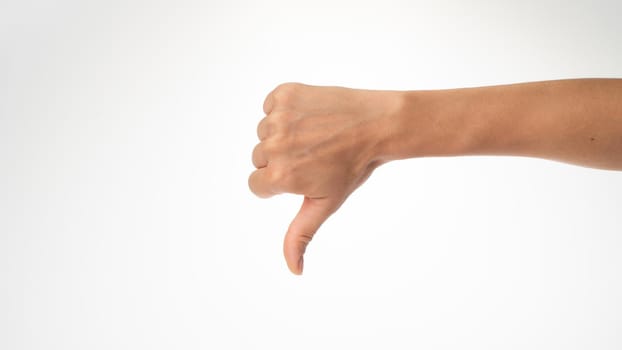 women's thumb down gesture don't like it. High quality photo