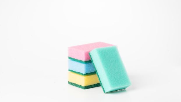 Colored sponges in a stack on a white background of the object. High quality photo