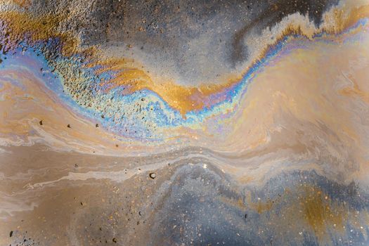 Color Gasoline fuel spots on Asphalt Road as Texture or Background. Environmental pollution concept