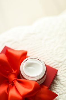 Beauty, cosmetics and skincare styled concept - Luxury face cream jar and red gift box