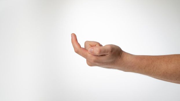 A man's hand gesture to call a finger to himself like a hook. High quality photo