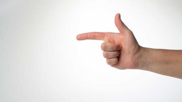 Male hand gesture folded like a gun insulated on a white background. High quality photo