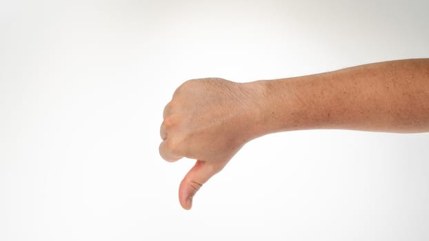 Men's thumb down gesture don't like it. High quality photo
