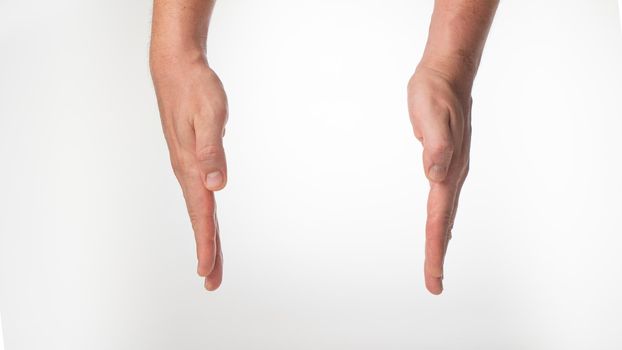 Men's hands put the box on white background. High quality photo