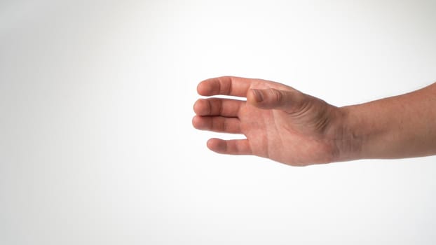 Hand man gesture place under glass bottle cylinder on white background. High quality photo