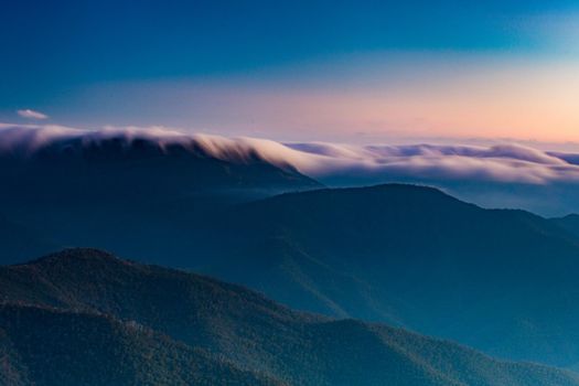 Landscape views of sunset from the summit of Mt Buller over the Victorian Alps in the Victorian High Country, Australia