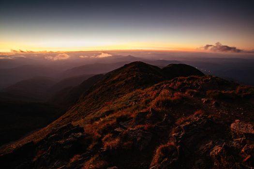 Landscape views of sunset from the summit of Mt Buller over the Victorian Alps in the Victorian High Country, Australia