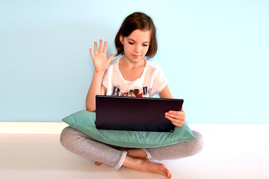 Girl student online learning class study online video call zoom teacher, Happy girl learn english language online with laptop at home. New normal. Social distancing. stay home . High quality photo