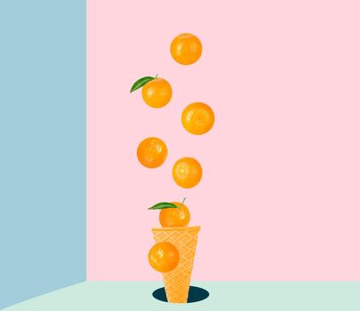 Isolated ice cream cone with fruits in the air. Seven falling whole tangerines on colored table with clipping path as package design element and advertising. Full depth of field.