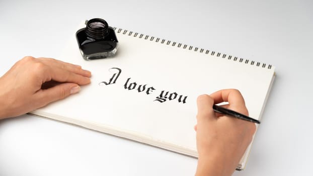 A woman writes a declaration of love calligraphy, ink and fountain pen